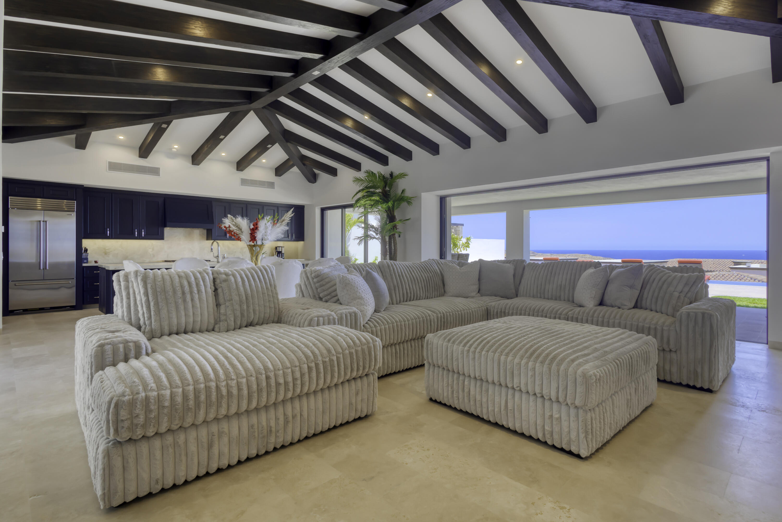 Quivira Coronado The Luna 5 bed home plan. The floor plan boasts a great room with vaulted ceilings over the living/dining area which looks out over the large covered terrace and the hand-made infinity edge pool beyond. The chefs kitchen with huge island with seating boasts Wolf and Sub-Zero appliances. The master and guest master have large ensuite baths w/ shower and tubs, and also both have ocean for sale